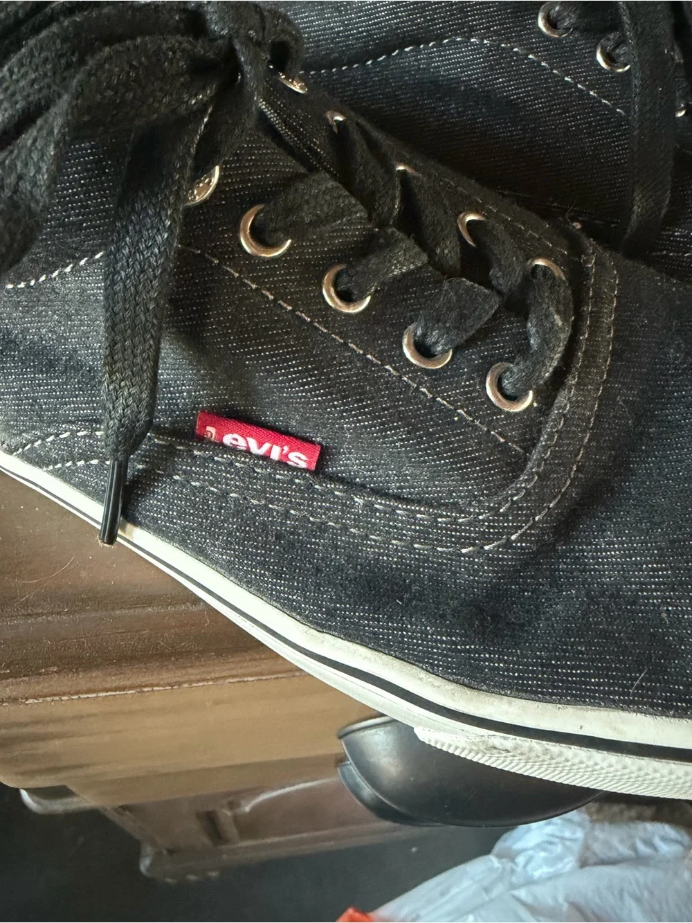 Levi's Black Canvas Low-Top Sneakers with Brown Heel Accent and White Sole